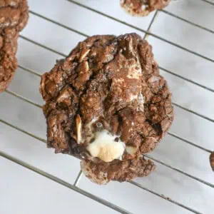 rocky road cookie on a baking rack.