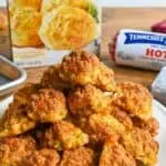 Close-up of crispy Red Lobster sausage balls on a white plate with packaging in background.