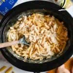 Creamy chicken pasta in a crockpot with olive garden ingredients and pasta.