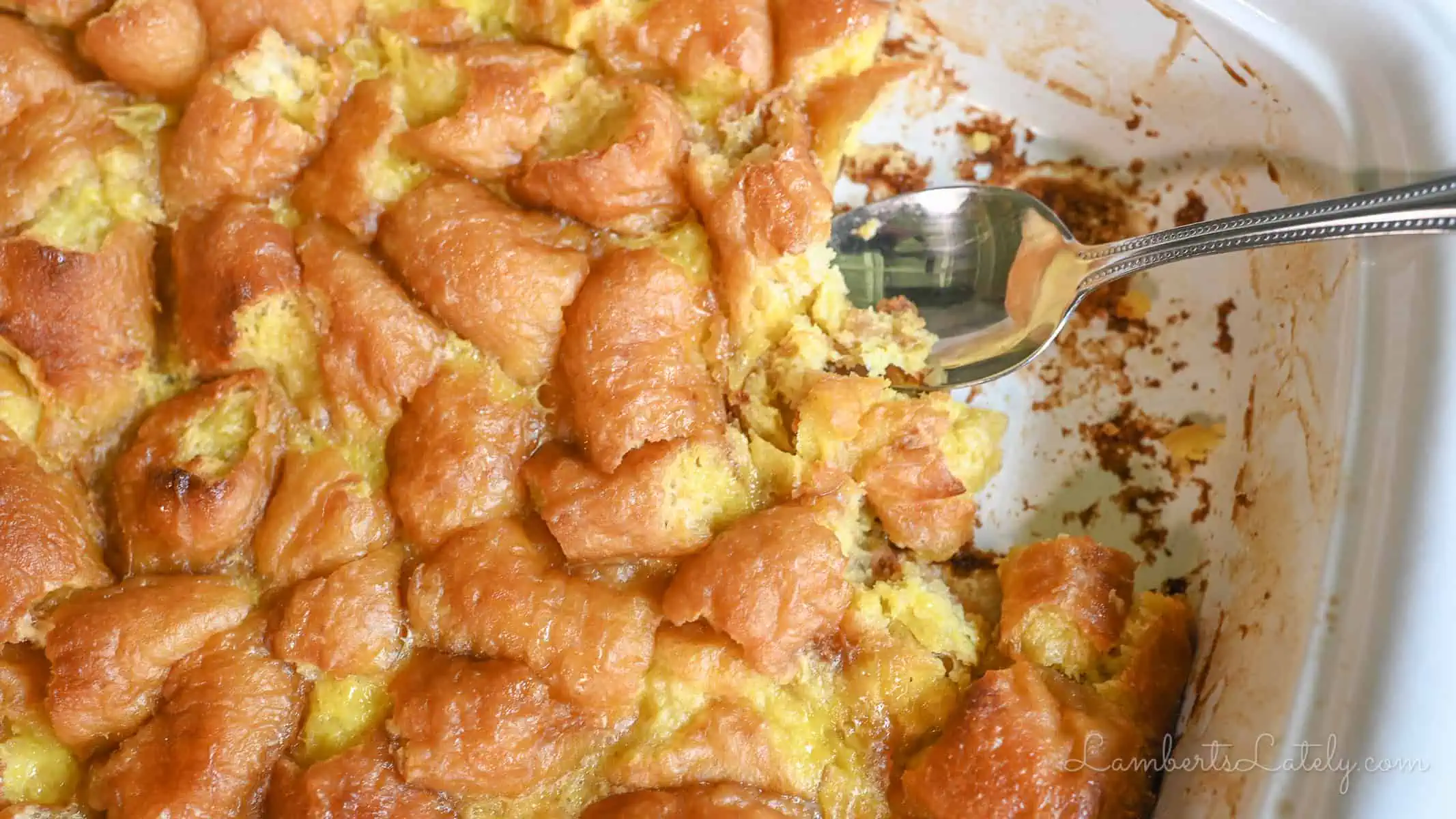 casserole dish of baked donut bread pudding.
