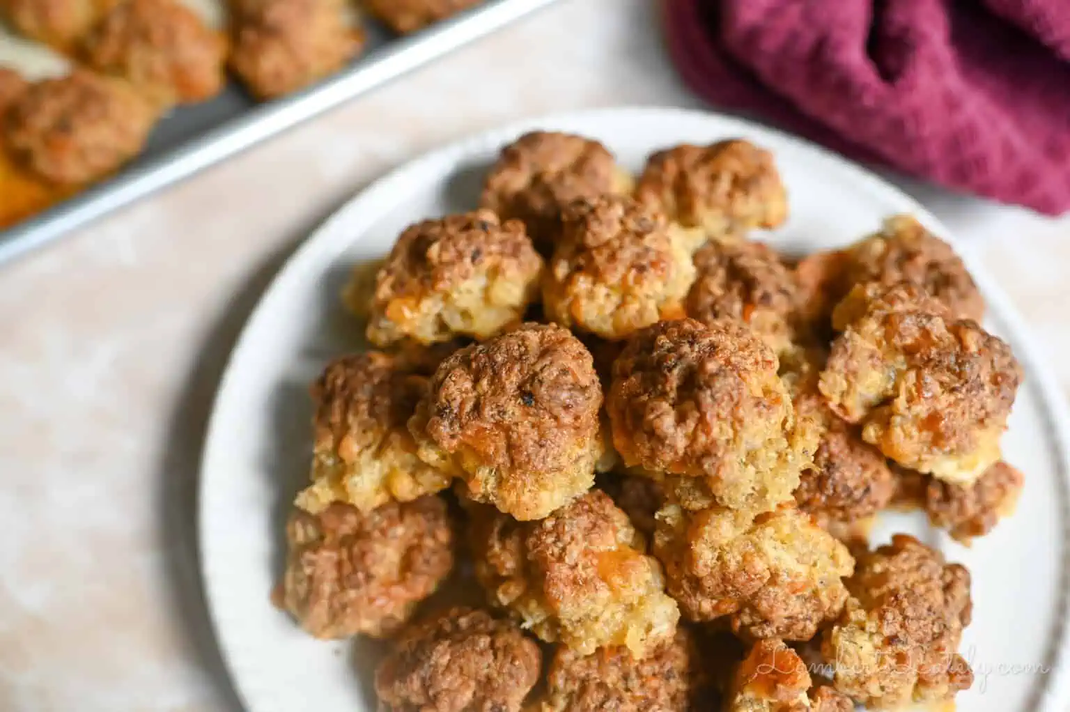 cooked sausage balls on a plate.