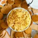Pumpkin Fluff Dip with Cool Whip, surrounded by cookies and ingredients, labeled as sweet and creamy.