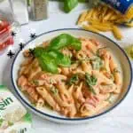 Creamy baked Boursin cheese pasta with fresh basil and cherry tomatoes.