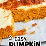 Close-up of pumpkin dessert bars with cream cheese frosting on a glass dish.