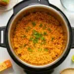 Delicious Mexican rice cooked in an Instant Pot with fresh herbs on top.