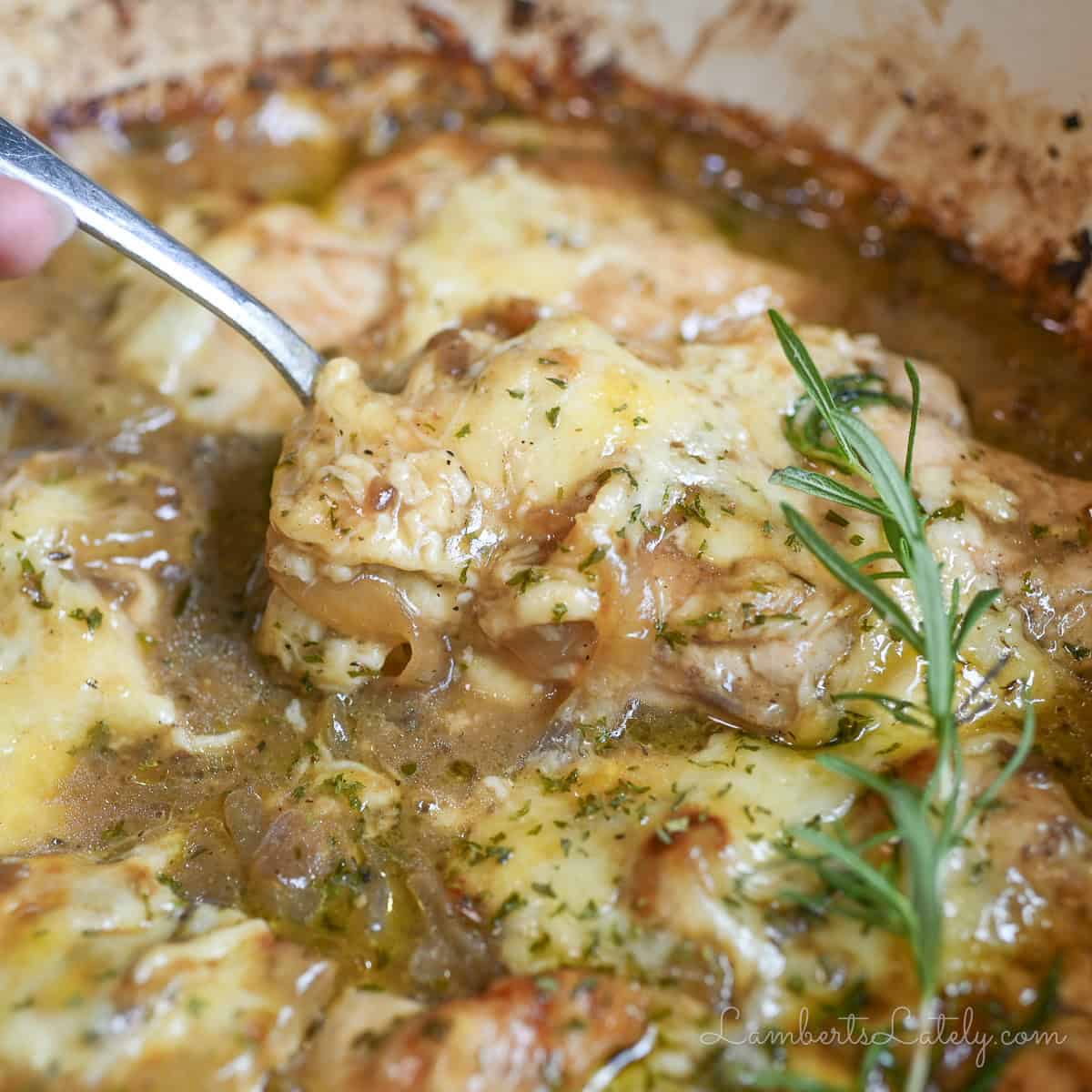 a spoon in french onion chicken bake.