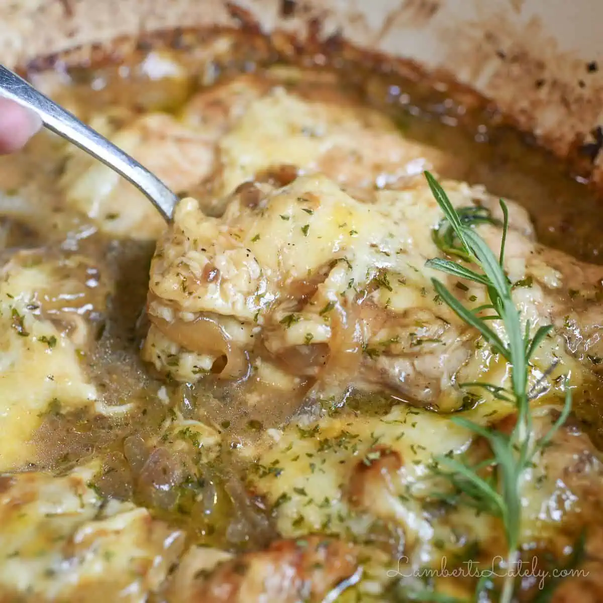 a spoon in french onion chicken bake.