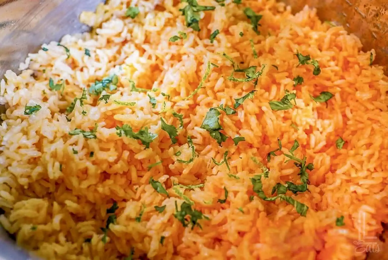 mexican rice in an instant pot, topped with chopped cilantro.