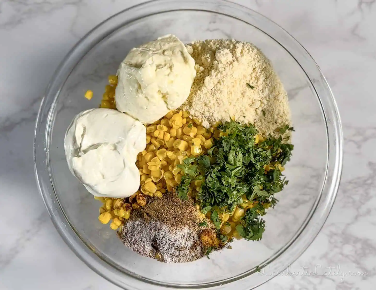 ingredients for mexican street corn casserole in a bowl.