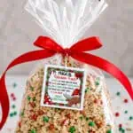 Reindeer food in a clear bag with a red ribbon and festive label for Christmas.