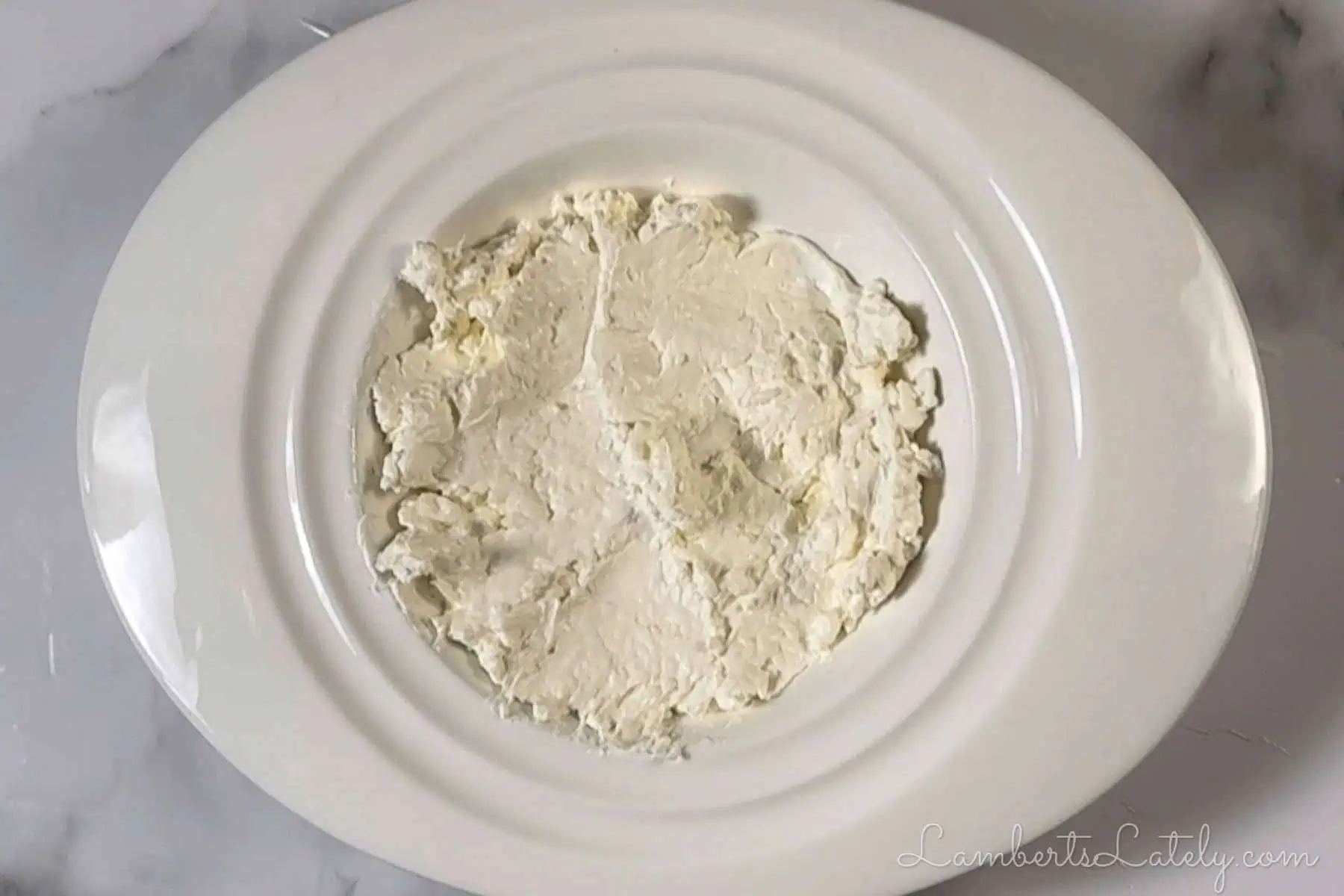 cream cheese spread in a dish.
