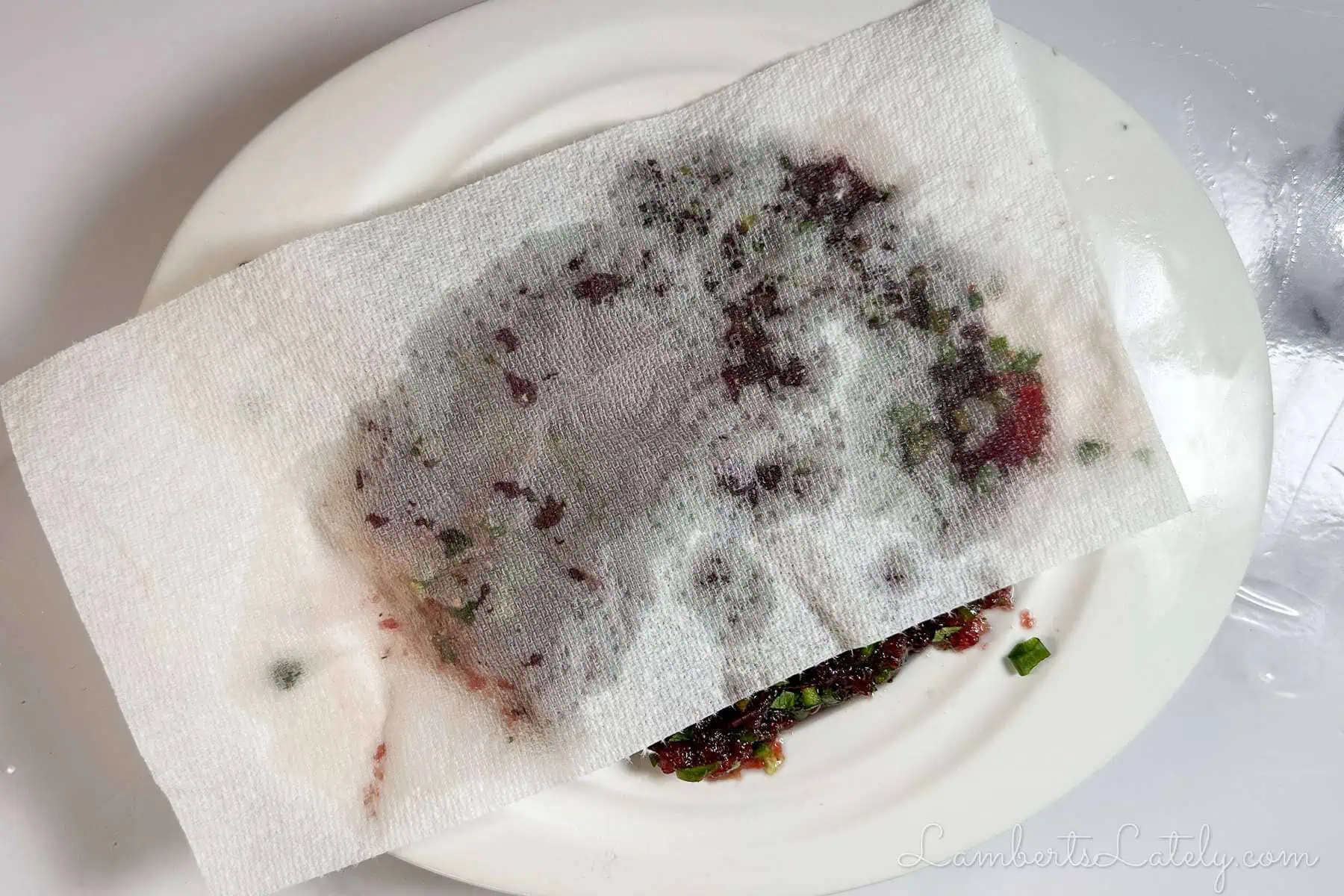 paper towel over the top of the cranberry layer.
