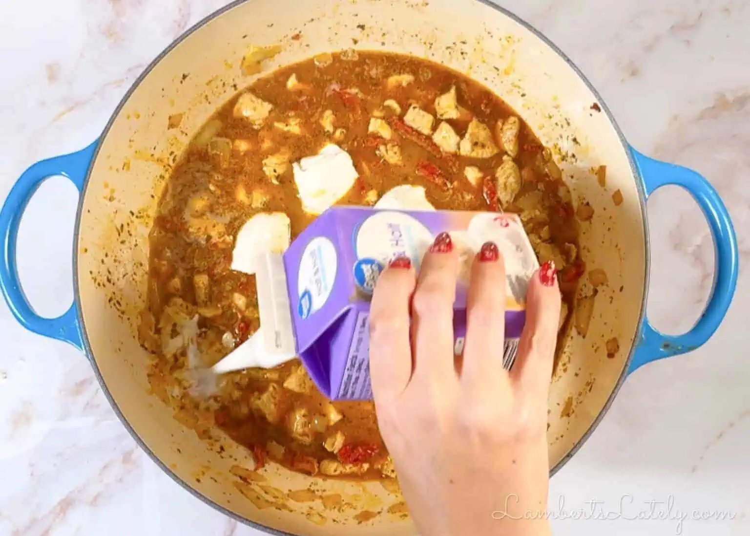 adding cream cheese and half & half to the soup.