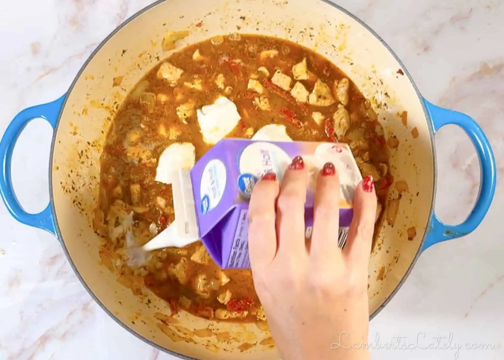 adding cream cheese and half & half to the soup.