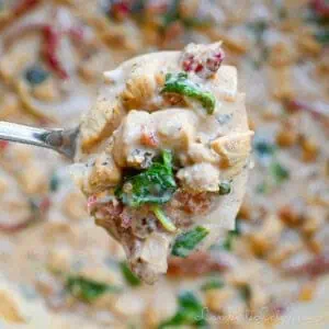 holding a spoonful of marry me chicken soup.