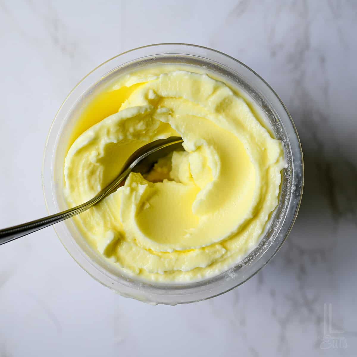looking down on a ninja creami container of dole whip pineapple soft serve.