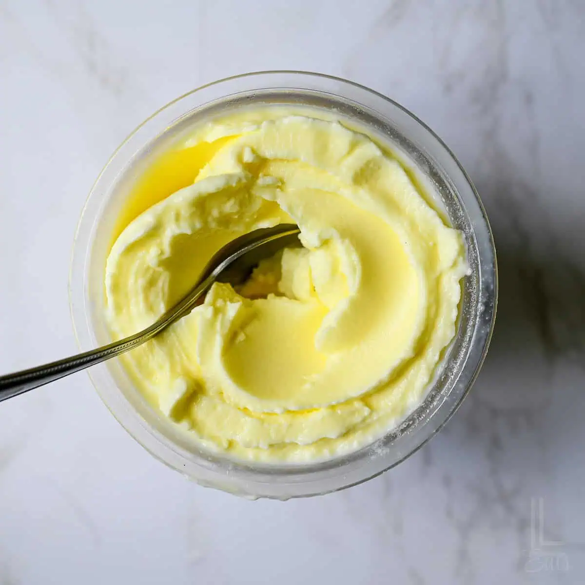 looking down on a ninja creami container of dole whip pineapple soft serve.