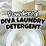 Powdered DIY laundry detergent in glass jar with scoop on countertop.