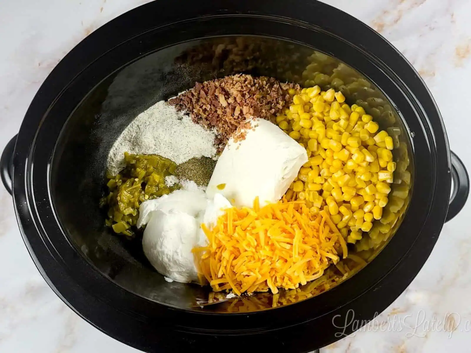ingredients for corn dip in a crock pot.