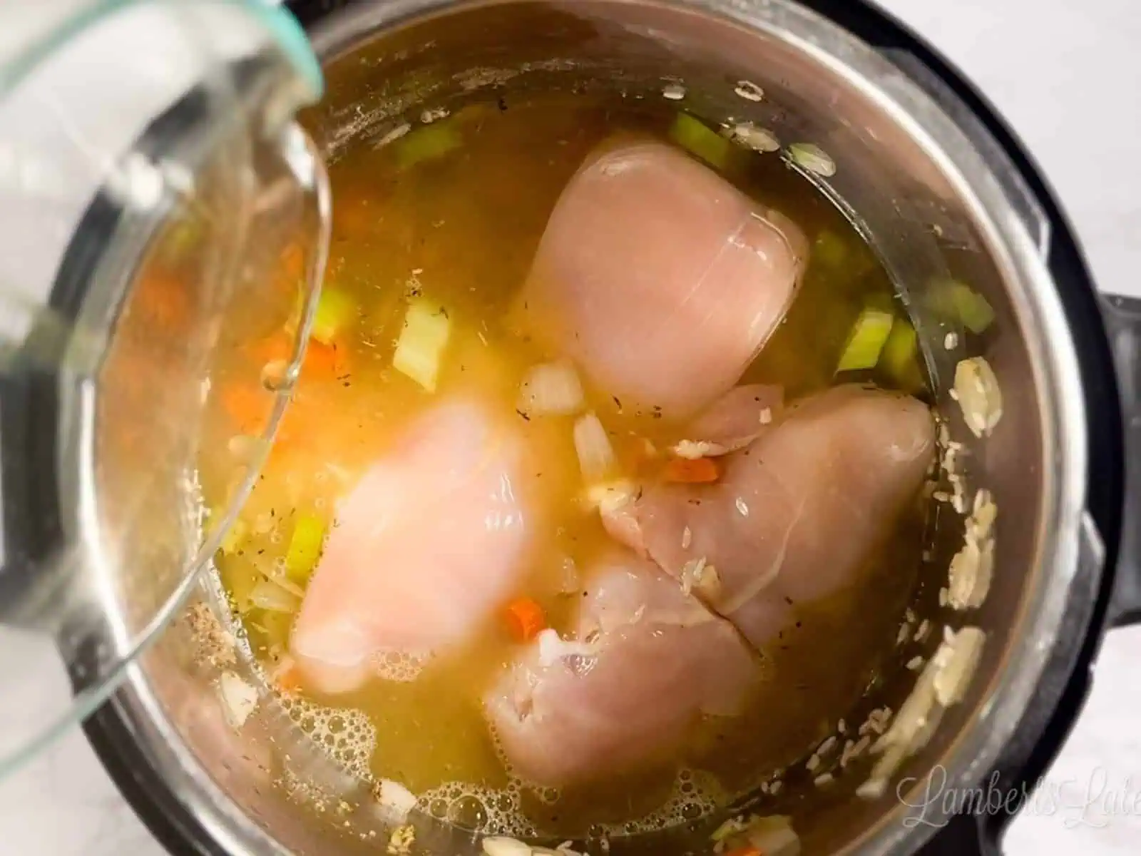 halved chicken breasts and chicken stock added to the instant pot.