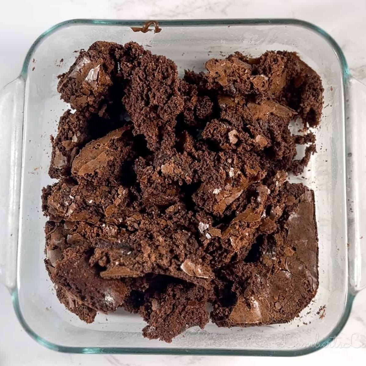 crumbled brownies in a baking dish.