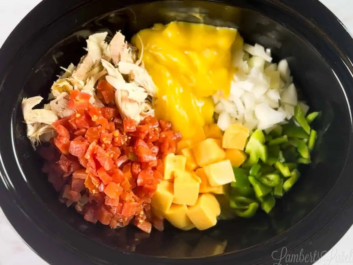 ingredients for chicken spaghetti in a crock pot.