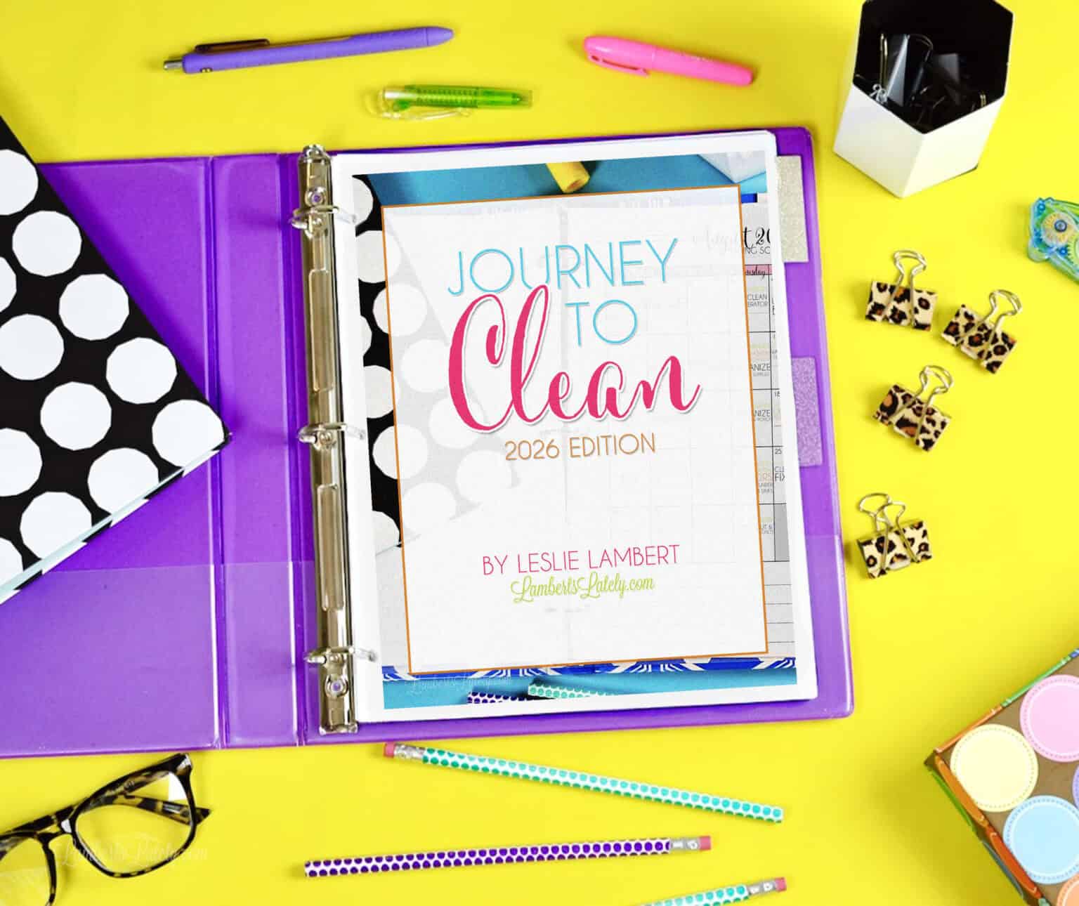 a copy of the cleaning ebook, journey to clean 2026, cover page in a notebook.