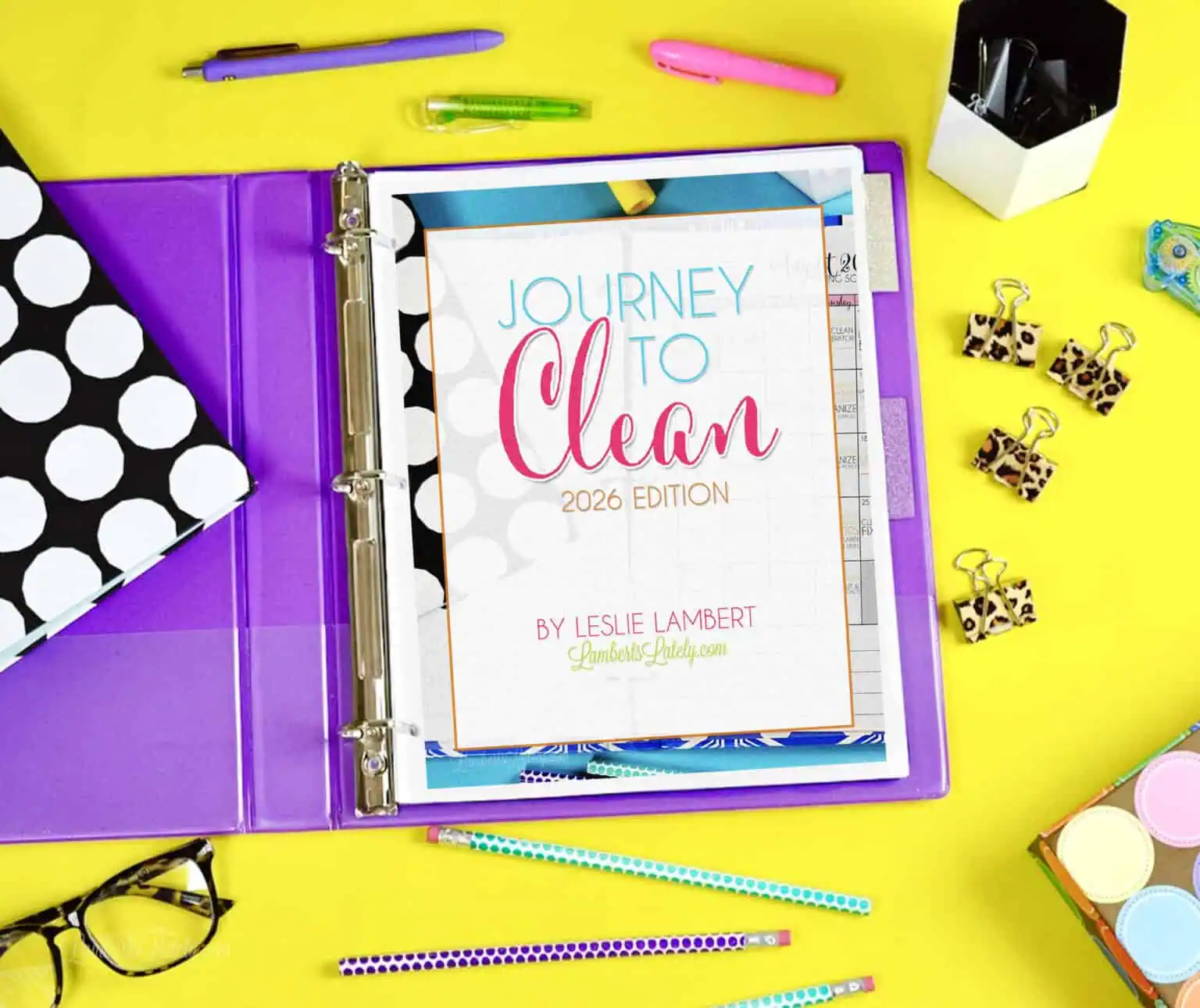 a copy of the cleaning ebook, journey to clean 2026, cover page in a notebook.