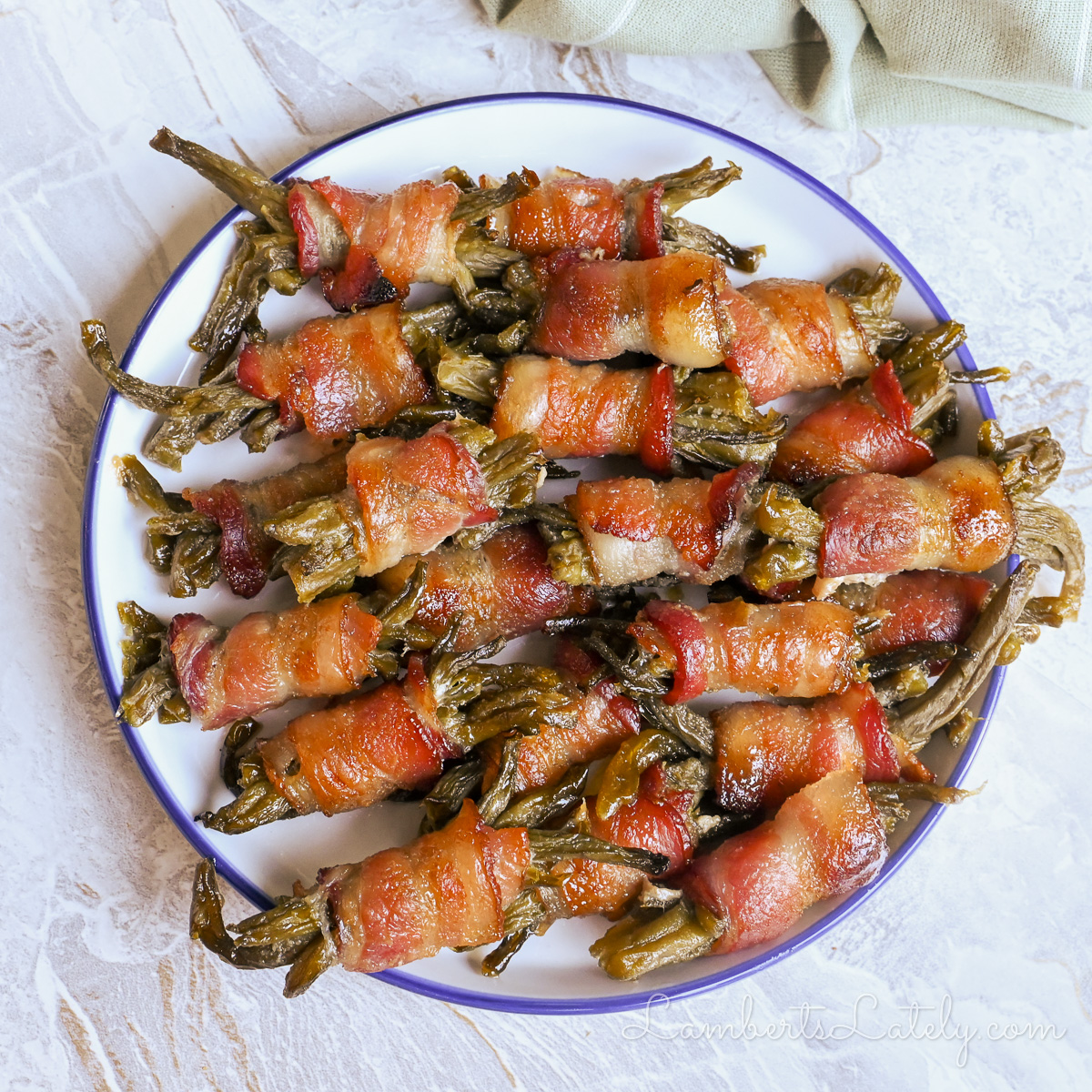 plate of bacon wrapped green bean bundles.