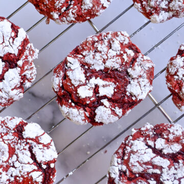 red velvet cool whip cookies cooling on a baking rack.