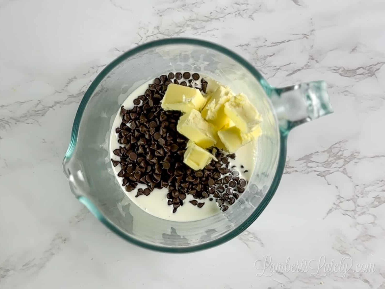 chocolate ganache ingredients in a measuring cup before warming.