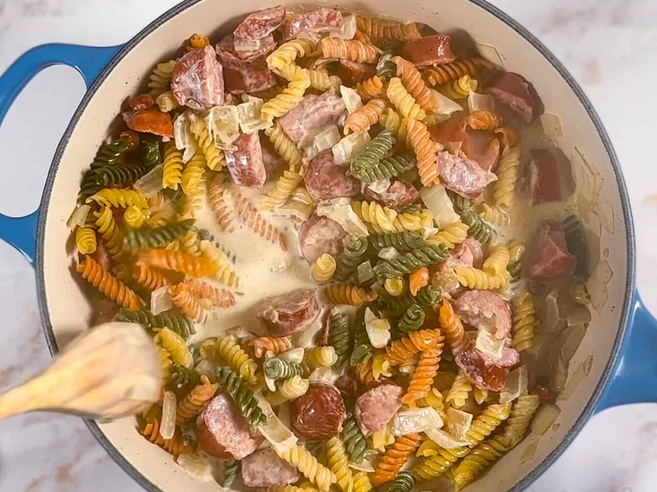 pasta, cream, chicken broth added to the pot.