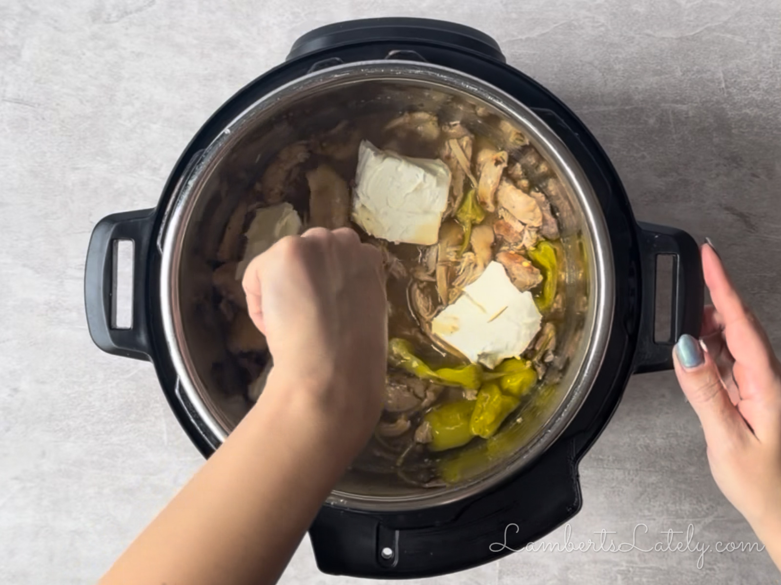 stirring cream cheese into shredded chicken mixture.
