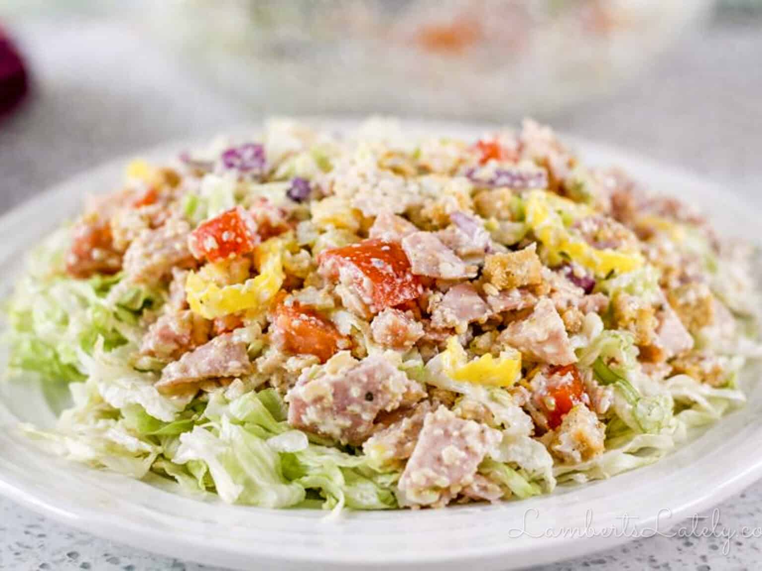 Italian hoagie salad mixture over iceberg lettuce.