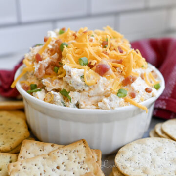 crack dip in a bowl, surrounded by crackers.