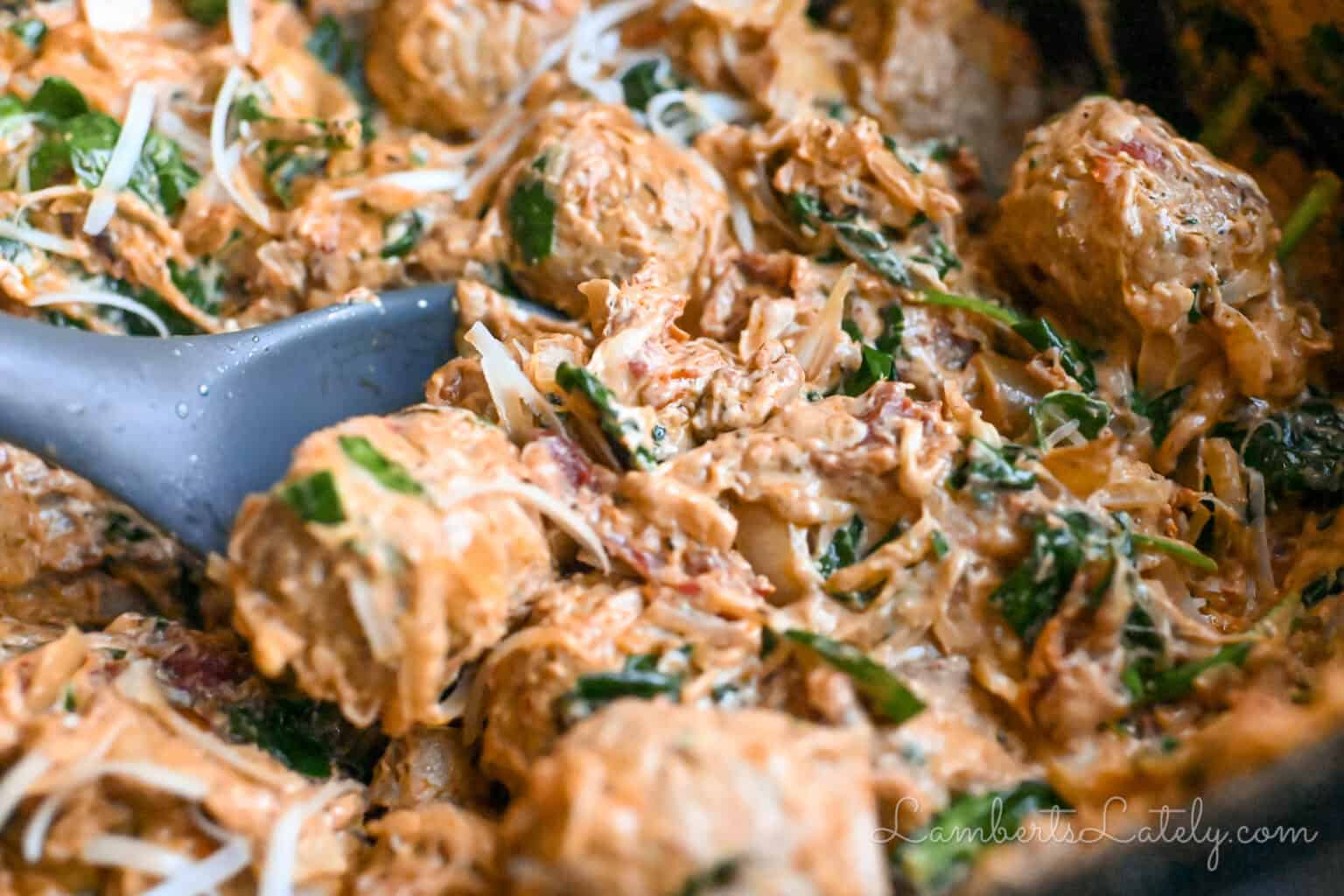 close up of marry me chicken meatballs in a crock pot.
