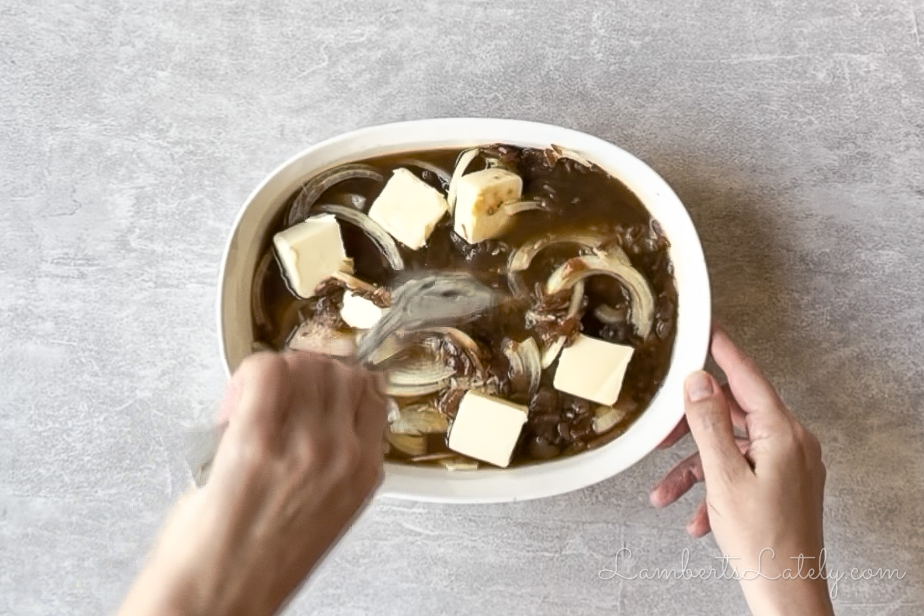 stirring the ingredients for french onion rice together.