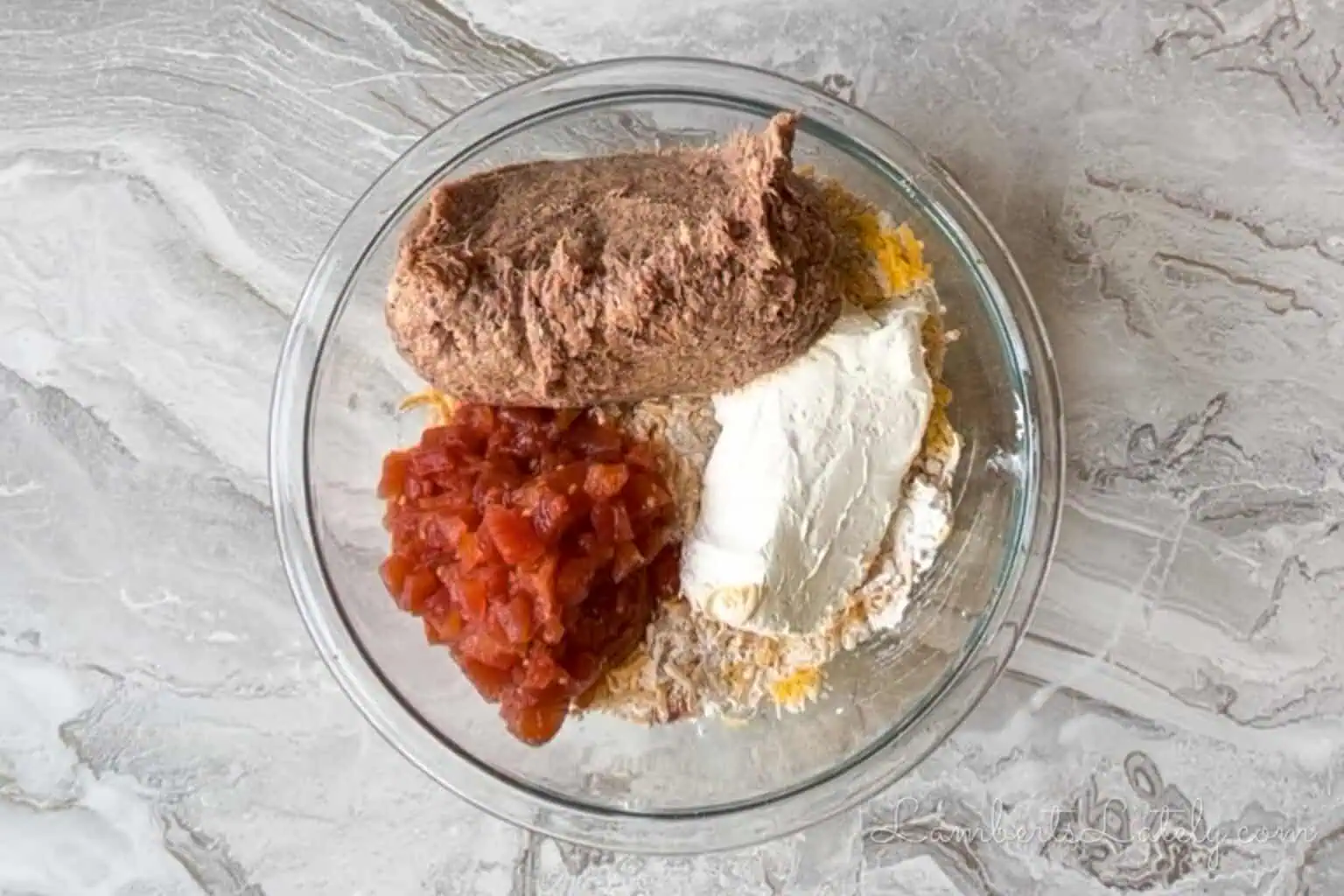 sausage, drained rotel, and cream cheese added to the bisquick and cheddar mixture.