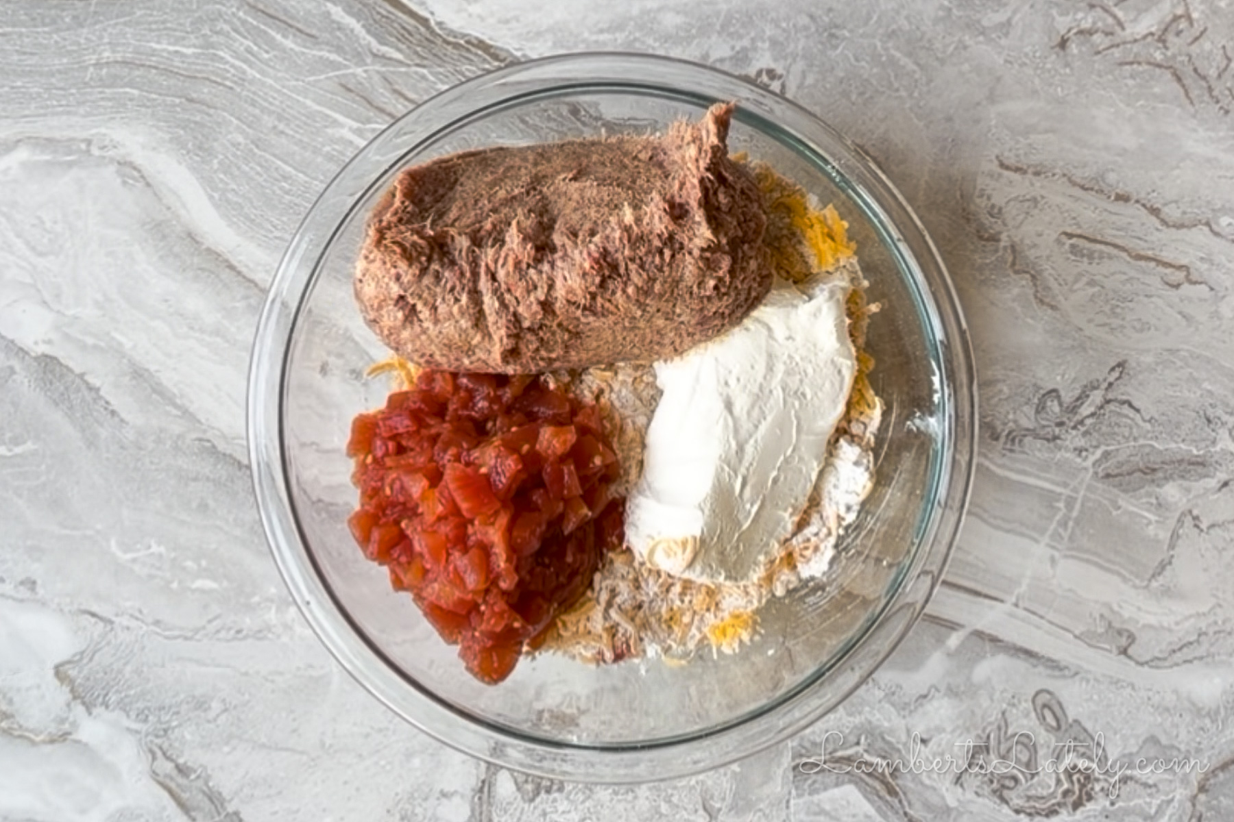 sausage, drained rotel, and cream cheese added to the bisquick and cheddar mixture.