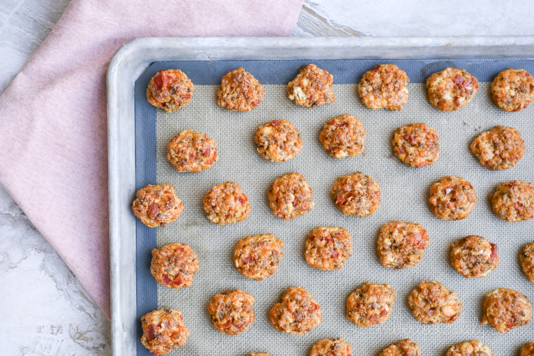 rotel cream cheese sausage balls on a pan after baking.