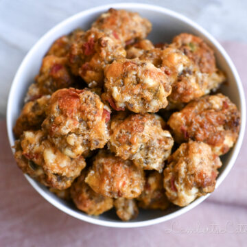 rotel cream cheese sausage balls in a bowl, next to a napkin.