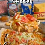 Delicious one-pot taco mac and cheese with melted cheese, tomatoes, and seasoned beef.