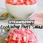 Close-up of strawberry fluff salad in a white bowl with fresh strawberries and whipped topping.