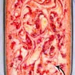 Strawberry Earthquake Cake with swirls of cheese and strawberries.