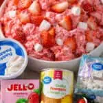 Strawberry Fluff Salad with strawberries, marshmallows, and whipped topping.