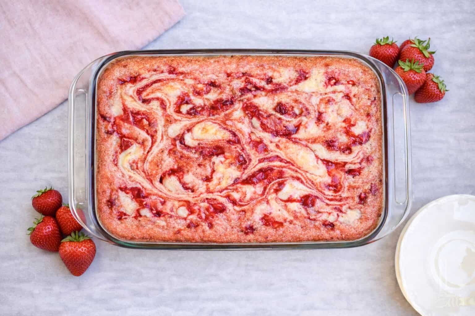 looking down on a baked strawberry cream earthquake cake.