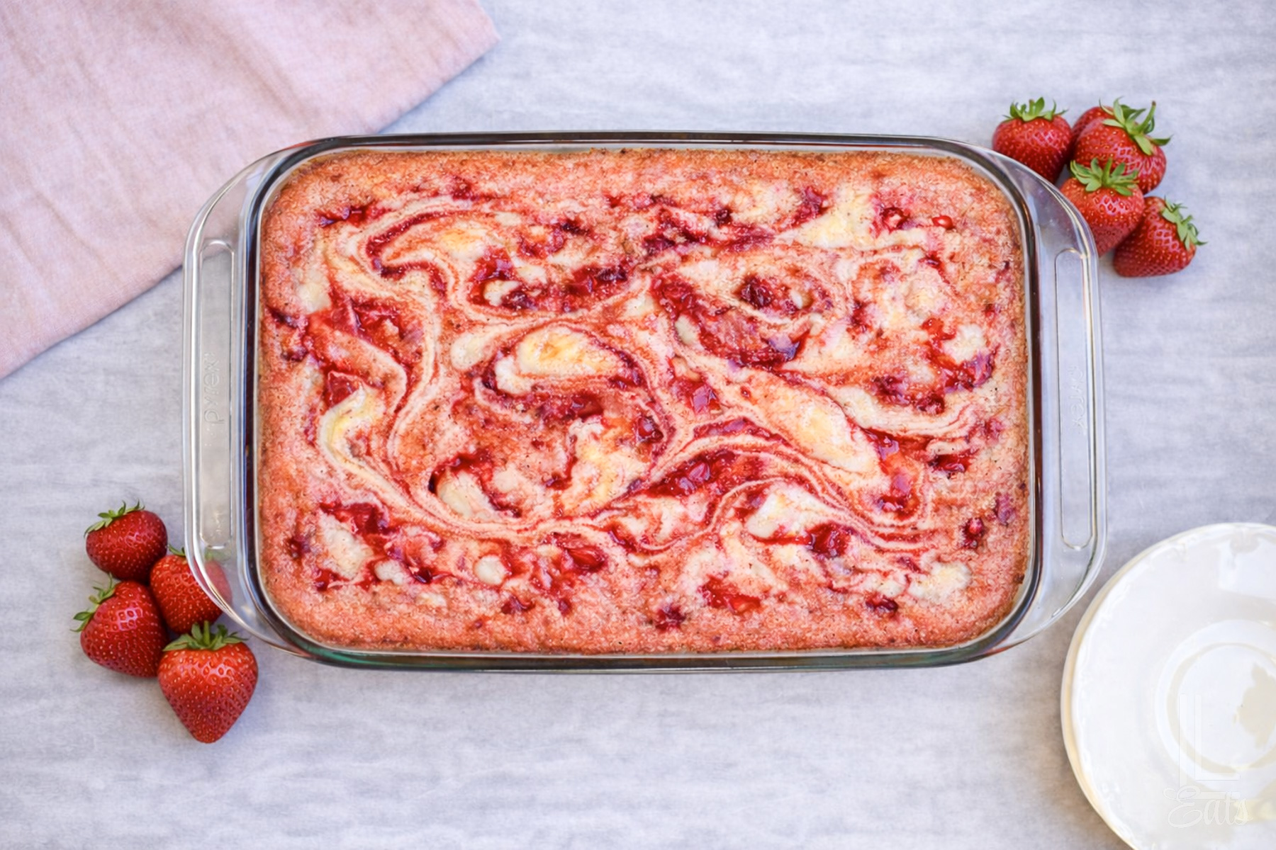 looking down on a baked strawberry cream earthquake cake.