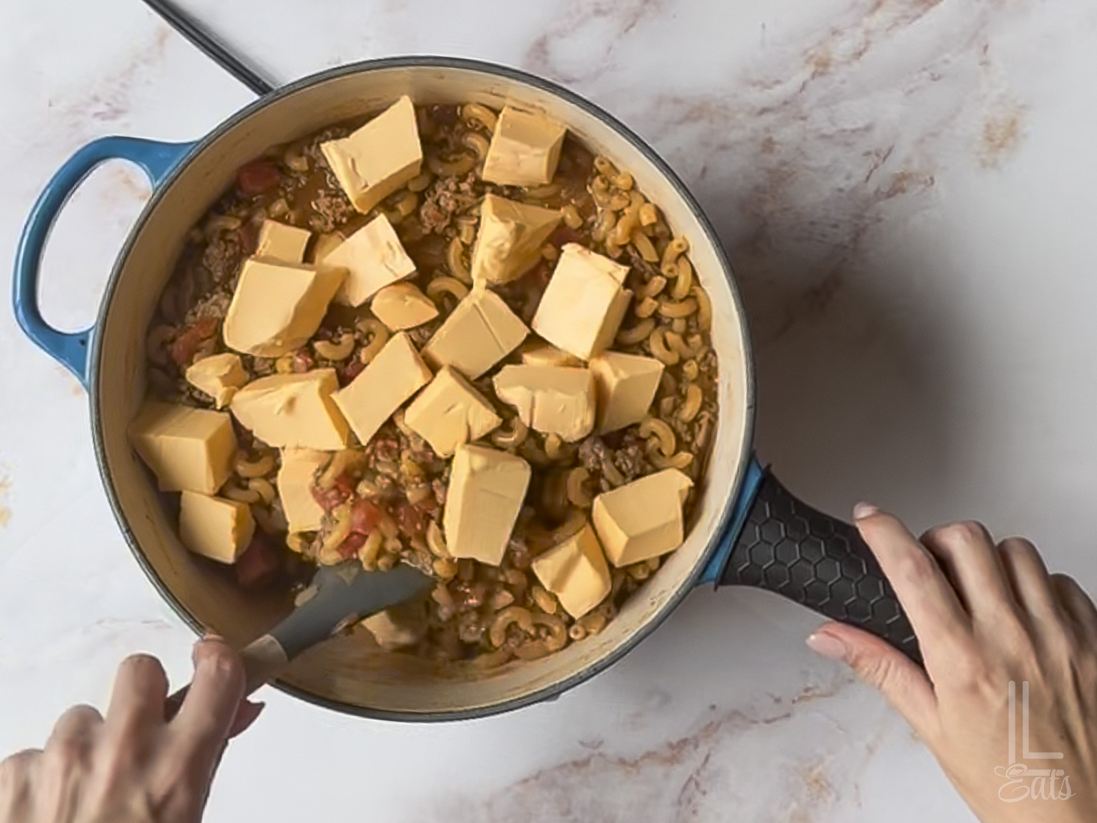 added velveeta cheese to the macaroni mixture.