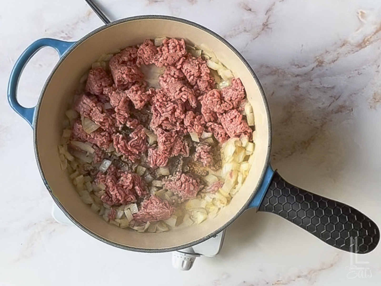 browning ground beef and onion in a large skillet.