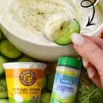 Creamy cottage cheese ranch dip with fresh cucumber slice for dipping.
